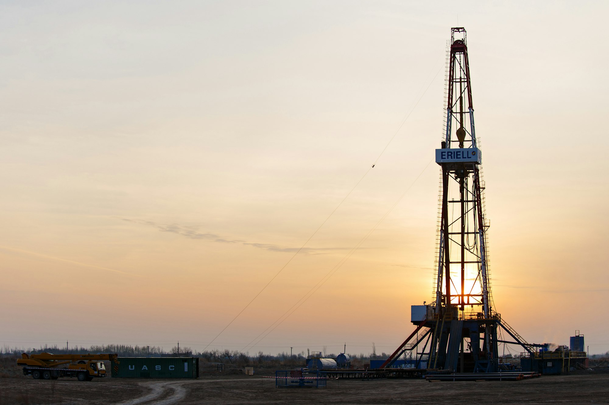 Onshore drilling rig at sunset